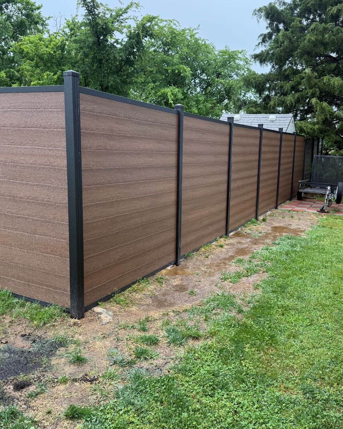 Composite fence panels installed in a horizontal layout by StackFence